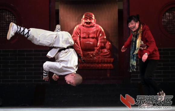 A-Chinese-monk-practices-Kong-Fu-with-a-Chinese-martial-arts-tourist-at-the-Shao.jpg
